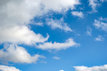 Blue sky background with a tiny clouds