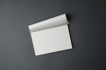 Open notepad on a gray background.