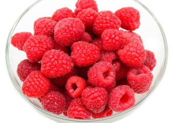 Ripe raspberries on a white background