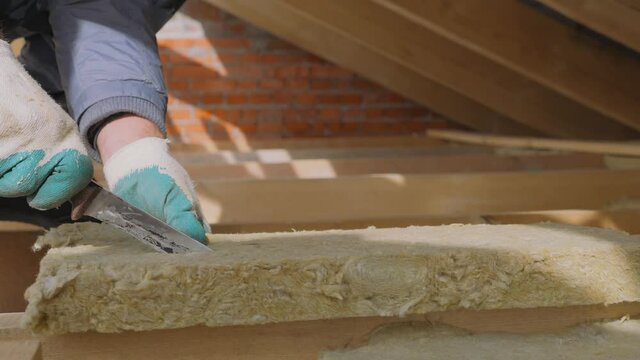 Construction work. Installation of insulation using.