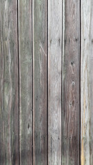 Old gray boards. A panel made of old weathered sedges. Wooden vintage background