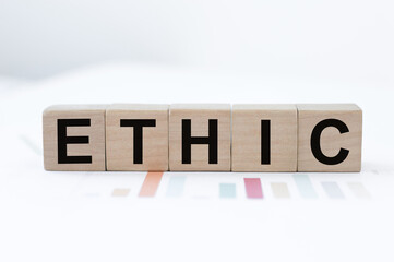 Ethic inscription on wooden cubes on the table