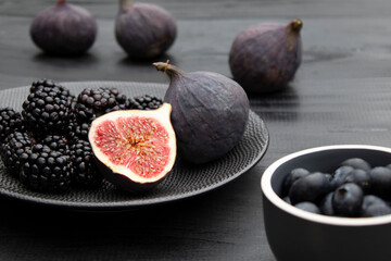 fresh figs and berries on a plate