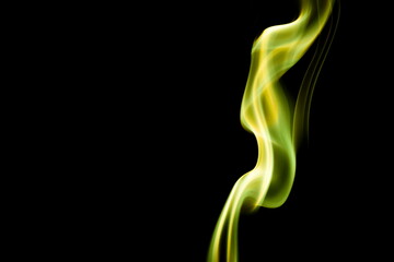 Yellow smoke on black background