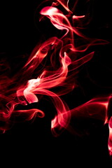 Red smoke on black background