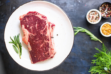 raw steak rib eye meat beef juicy on the table serving size second course top view copy space for text food background rustic