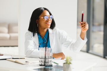 African American doctor working in her office at clinic