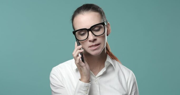 Angry businesswoman shouting on the phone