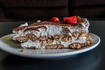 Biscuit and strawberry cake with whipped cream