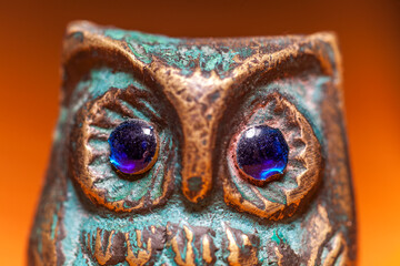 Owl eyes on a metal figurine
