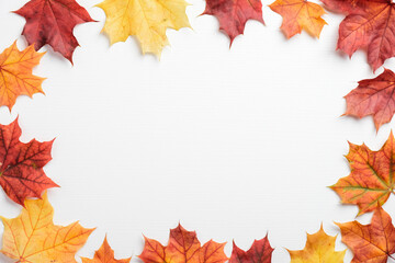 Naklejka na ściany i meble Autumn frame made of colorful maple leaves on white table. Autumn sale banner mockup, greeting card template. Flat lay, top view, minimalist style.
