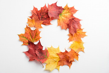 Autumn maple leaves wreath frame on white background. Autumn fall, thanksgiving concept.