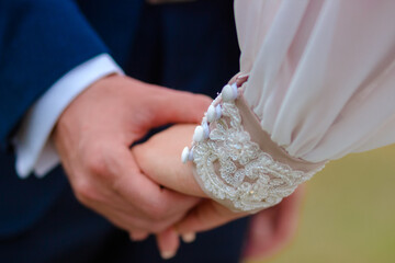 Wedding theme. Wedding couple holding hands. 