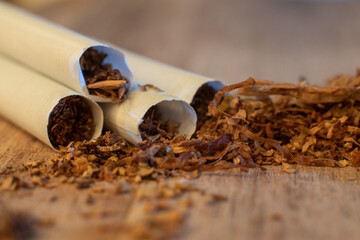 cigarettes and tobacco on wood