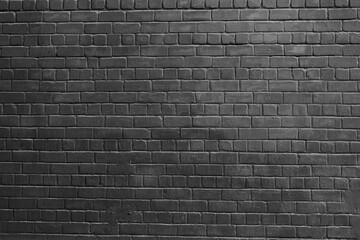 Stylish wall from brick painted in dark gray