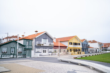 Colorful striped houses on the beach of Costa Nova. Original design in a fisherman's village. Aveiro, Portugal.
