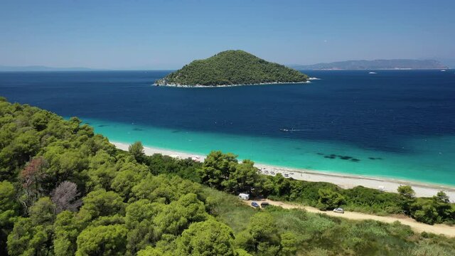 Aerial drone photo of paradise turquoise sandy beach of Milia covered in pine trees, Skopelos island, Sporades, Greece