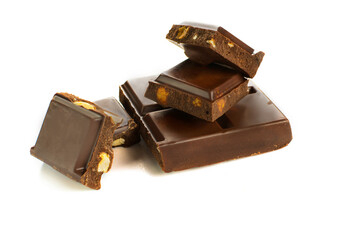 Broken dark chocolate blocks stack isolated on white background