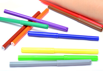 flamasters of different colors on a white background with a place for text close-up.