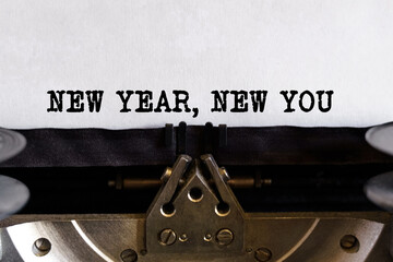 Vintage typewriter with printed text - NEW YEAR NEW YOU, on a sheet of paper
