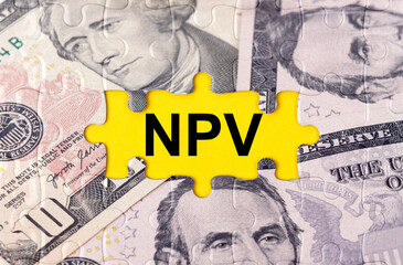 Puzzle with the image of dollars in the center of the inscription -NPV