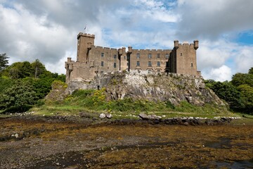 Dunvegan Castle at Isle of Skye, Scotland during the low tide