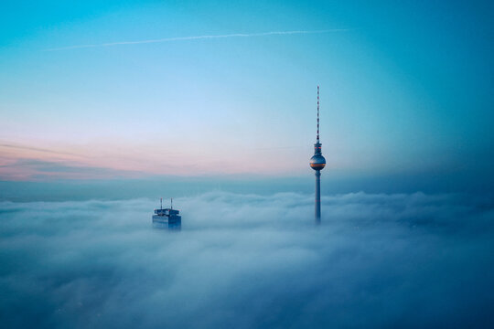 Scenic view of Fernsehturm Berlin tower against sky in morning