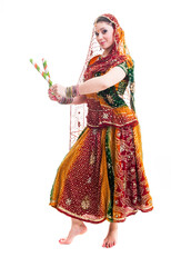 Obraz premium Bollywood dancer in traditional vivid Indian dress in various poses