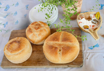 three breads on the wooden plate