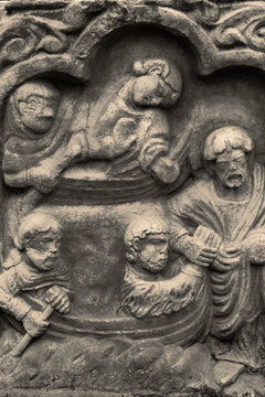 Stone carving depicting Christ and the apostles.  With colour toning