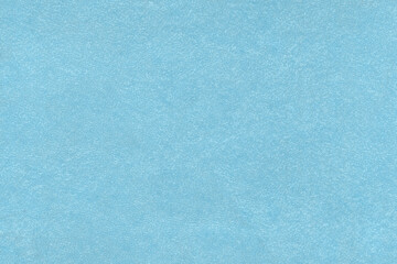 Vintage and old looking paper background. Colored blue retro book cover. Ancient book page.