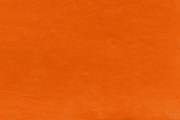 Vintage and old looking paper background. Colored orange with a brown retro book cover. Ancient book page.