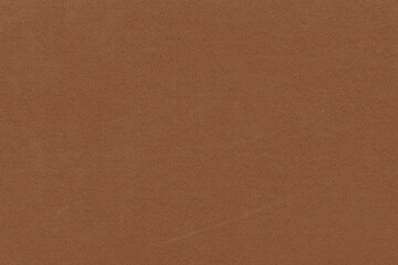 Vintage and old looking paper background. Colored orange with a brown retro book cover. Ancient book page.