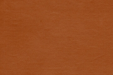 Vintage and old looking paper background. Colored orange with a brown retro book cover. Ancient book page.