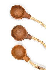Photo of a ceramic teaspoon with a wooden handle made of twigs