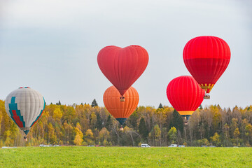 Morning flight of the hot air balloons above the countryside.