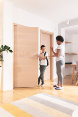 Mother saying bye to son leaving for school