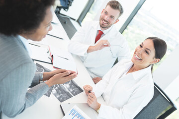 Fototapeta premium Black woman discussing artificial insemination with doctors