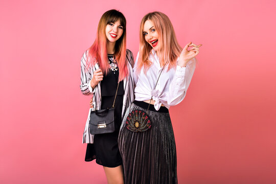 Indoor Studio Portrait Of Two Happy Best Friends Sisters Women, Wearing Trendy Black And White Clothes And Pink Hairs, Glamorous Evening Feminine Outfits, Party Mood.