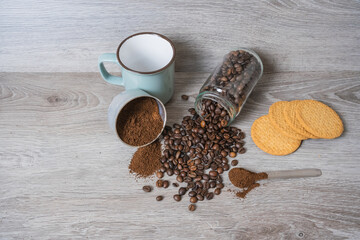 a cup on the table with coffee beans