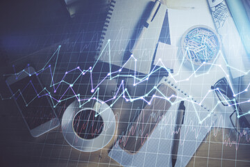 Double exposure of forex graph drawing and work table top veiw. Concept of financial analysis.