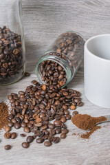 a cup on the table with coffee beans