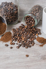 a cup on the table with coffee beans