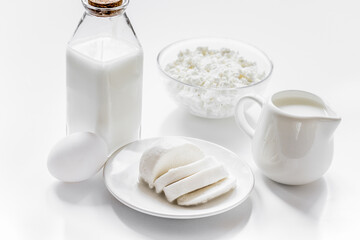 dairy products for proteic meal on white table background