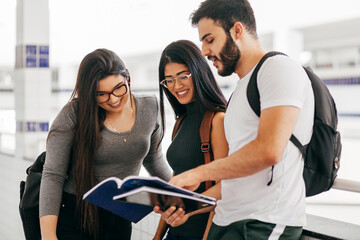 Group of college students talking in corridor