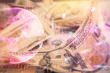 Double exposure of forex graph drawing over us dollars bill background. Concept of financial markets.