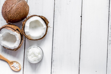 organic cosmetics with coconut on white background top view