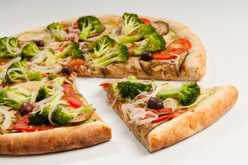 Slice Vegetarian Pizza, with tomato sauce, broccoli, tomatoes, zucchini, eggplant and onion rings