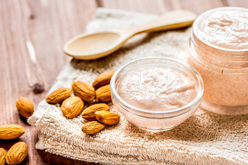 natural scrub with almond on wooden table background