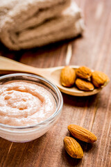 natural scrub with almond on wooden table background